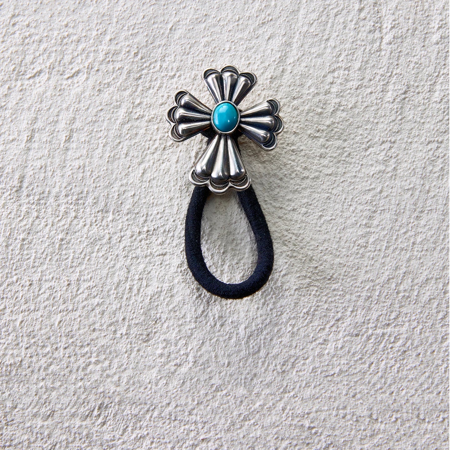 Metal cross flower hair tie with turquoise center