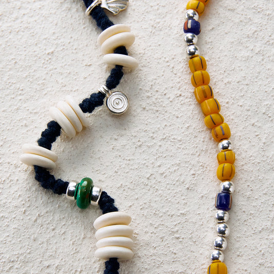 Tribal-style beaded necklace with turquoise and yellow glass beads