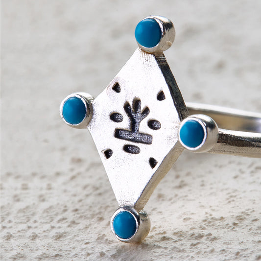 Silver ring with tree totem engraving and four turquoise inlays