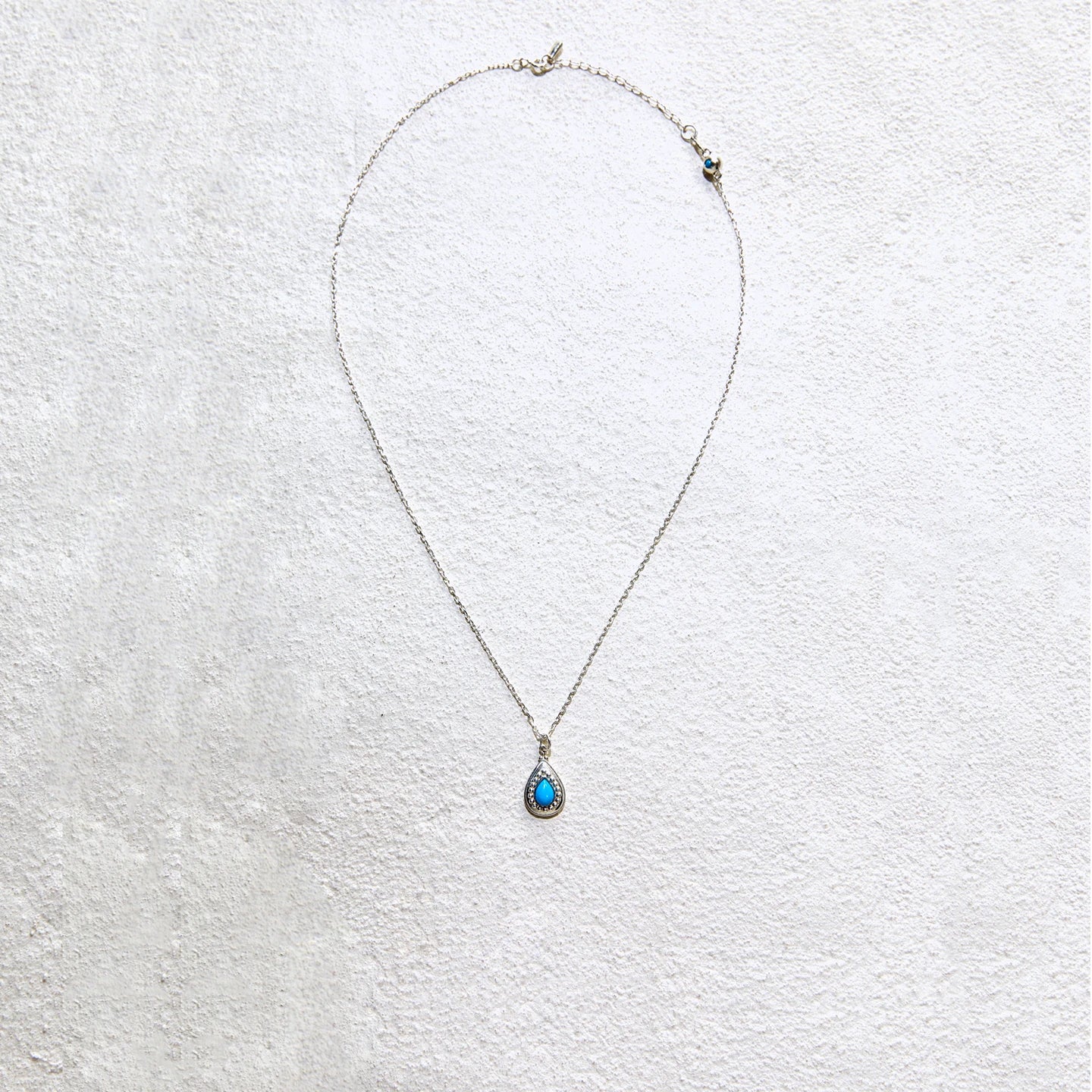 Elegant teardrop turquoise pendant with delicate silver chain