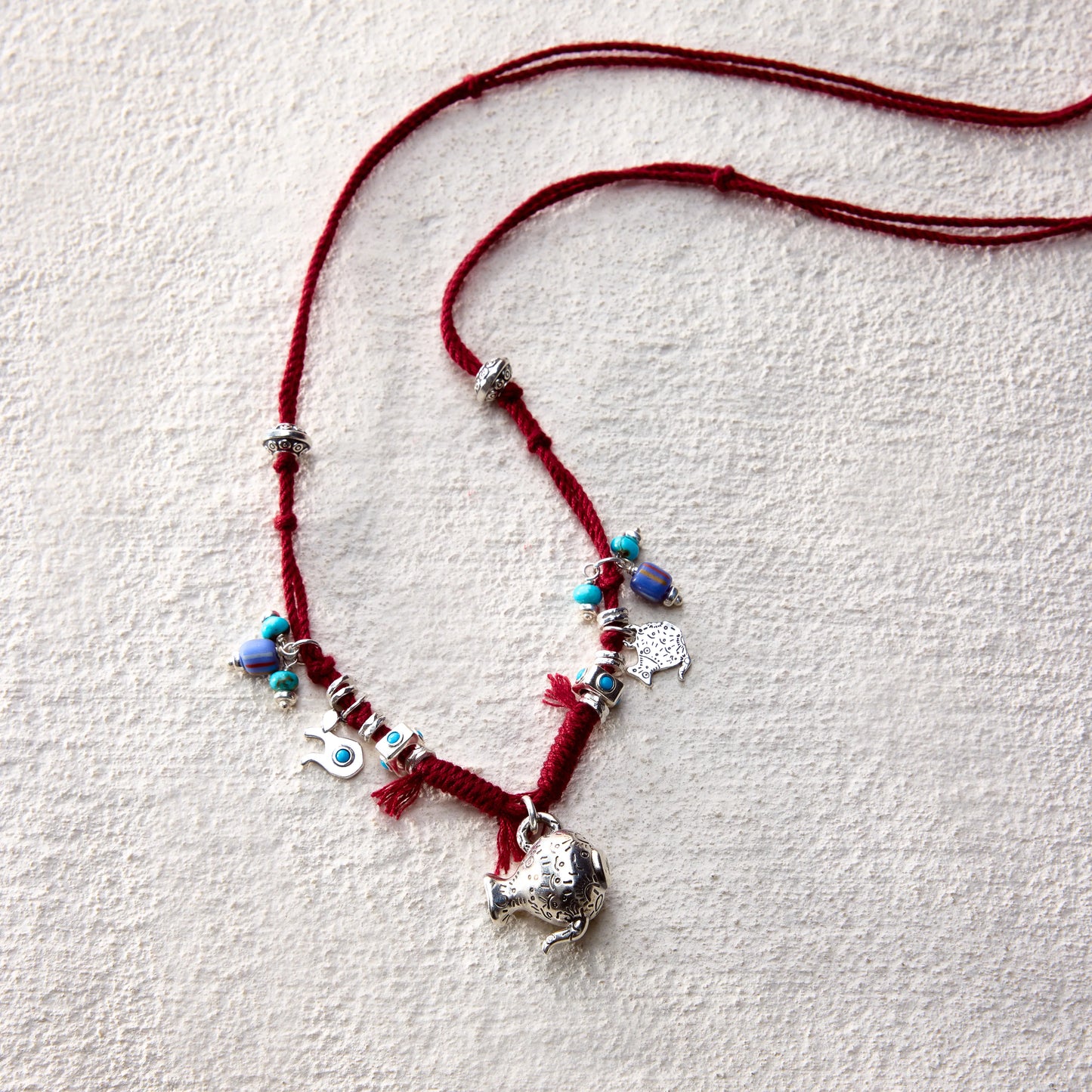 ensage-tokyo-nomads-vessel-necklace-red-braided-cotton-cord-silver-flask-pendant-turquoise-beads-charms