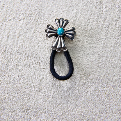 Metal cross flower hair tie with turquoise center