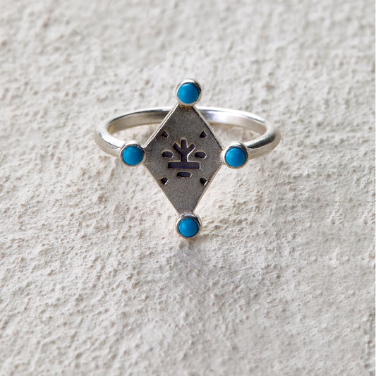 Silver ring with tree totem engraving and four turquoise inlays