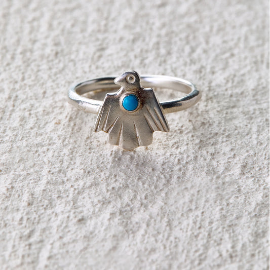 Carved spirit bird ring featuring turquoise, symbolizing protection and intuition