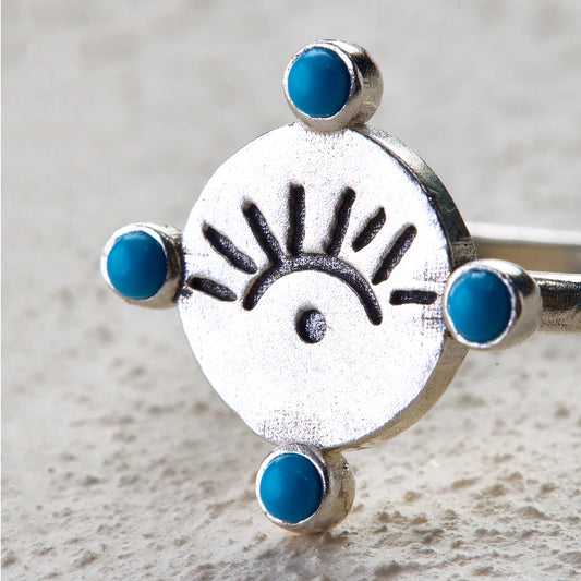 Silver ring with sunrise eye totem and four turquoise inlays