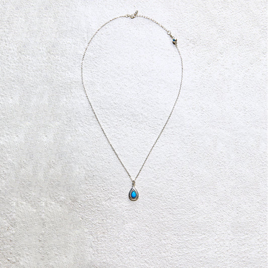 Elegant teardrop turquoise pendant with delicate silver chain