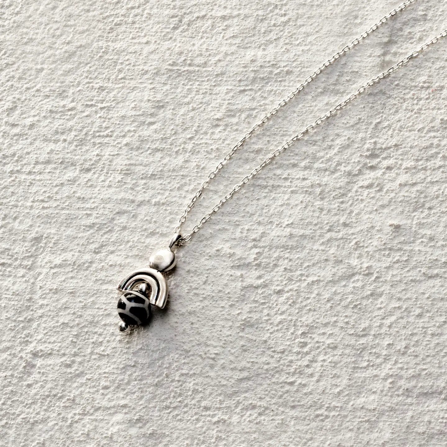 ensage-tokyo-eye-of-the-nomad-necklace-925-sterling-silver-double-arch-pendant-black-white-agate-bead