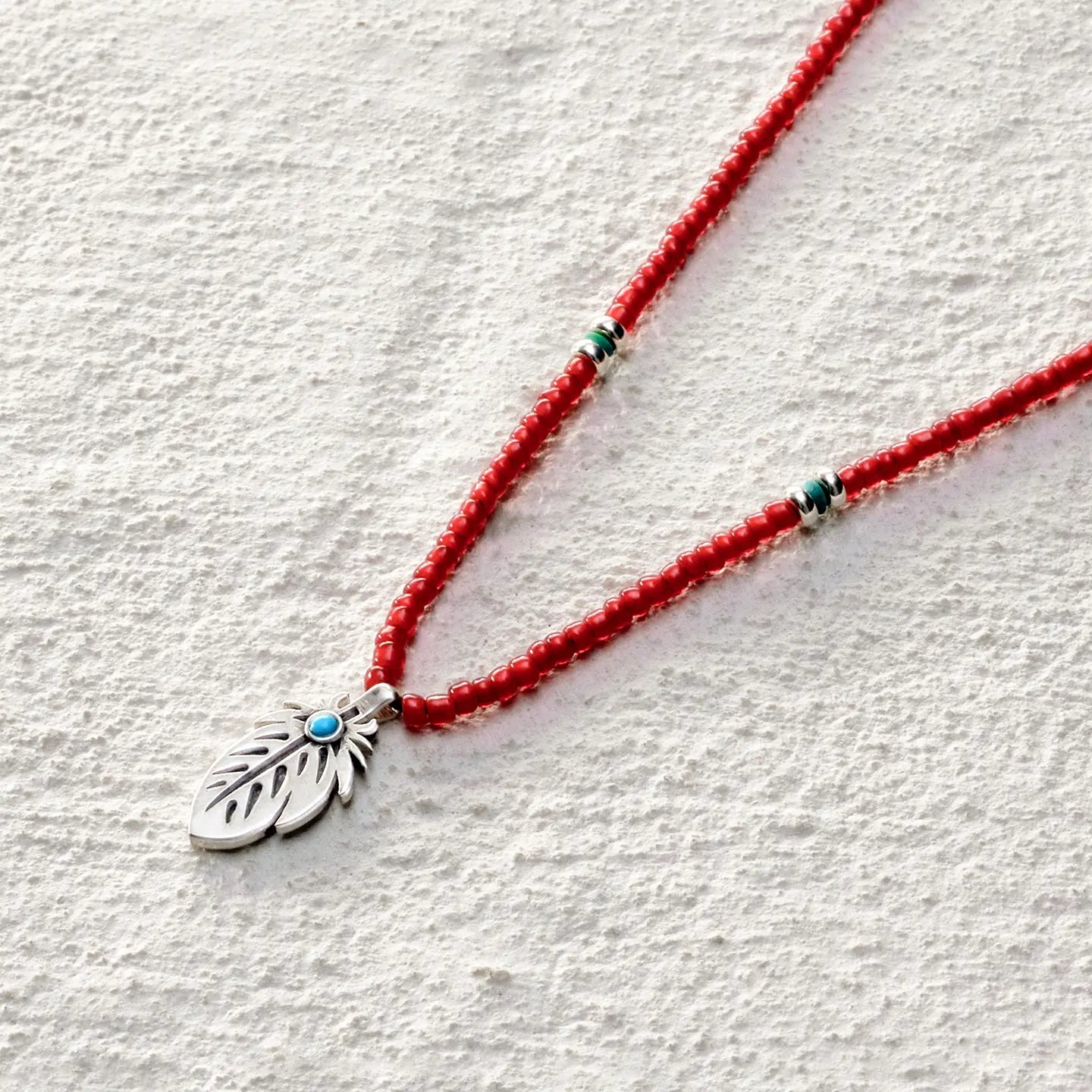 ensage-tokyo-feather-necklace-925-sterling-silver-engraved-pendant-red-glass-beads-turquoise-inlay