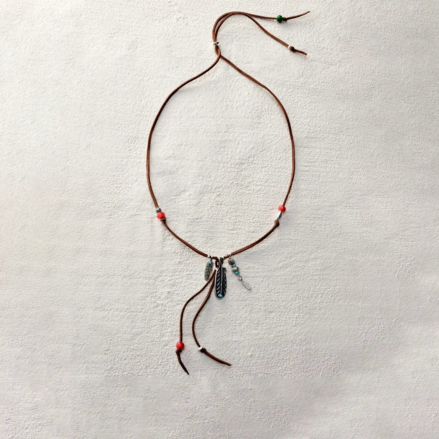 ensage-tokyo-feather-talisman-necklace-brown-leather-cord-925-silver-feather-pendant-turquoise-red-beads