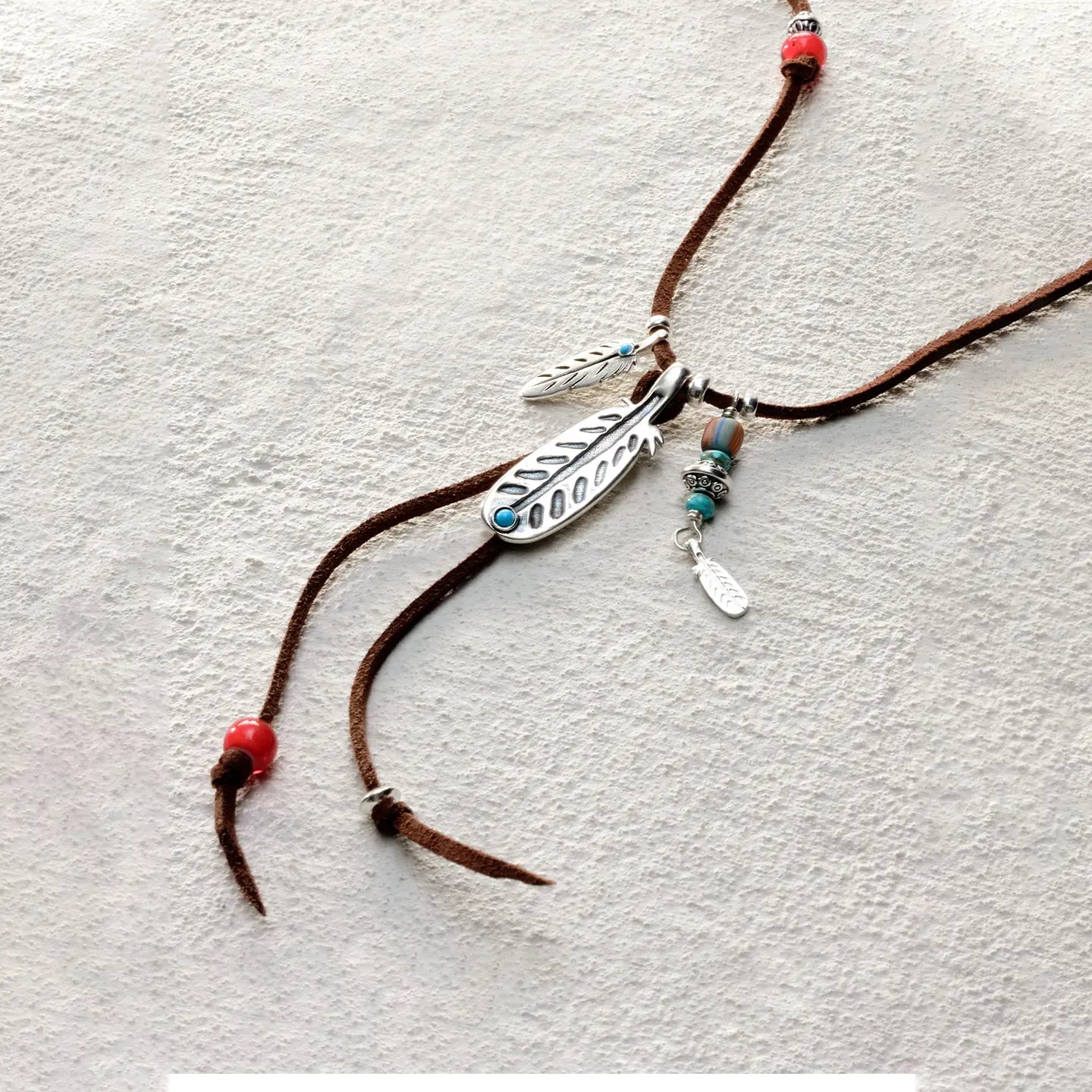 ensage-tokyo-feather-talisman-necklace-brown-leather-cord-925-silver-feather-pendant-turquoise-red-beads