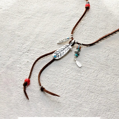 ensage-tokyo-feather-talisman-necklace-brown-leather-cord-925-silver-feather-pendant-turquoise-red-beads