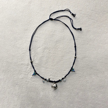 ensage-tokyo-nomads-vessel-necklace-blue-braided-cotton-cord-silver-flask-pendant-turquoise-beads