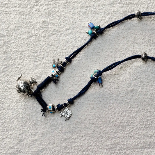 ensage-tokyo-nomads-vessel-necklace-blue-braided-cotton-cord-silver-flask-pendant-turquoise-beads