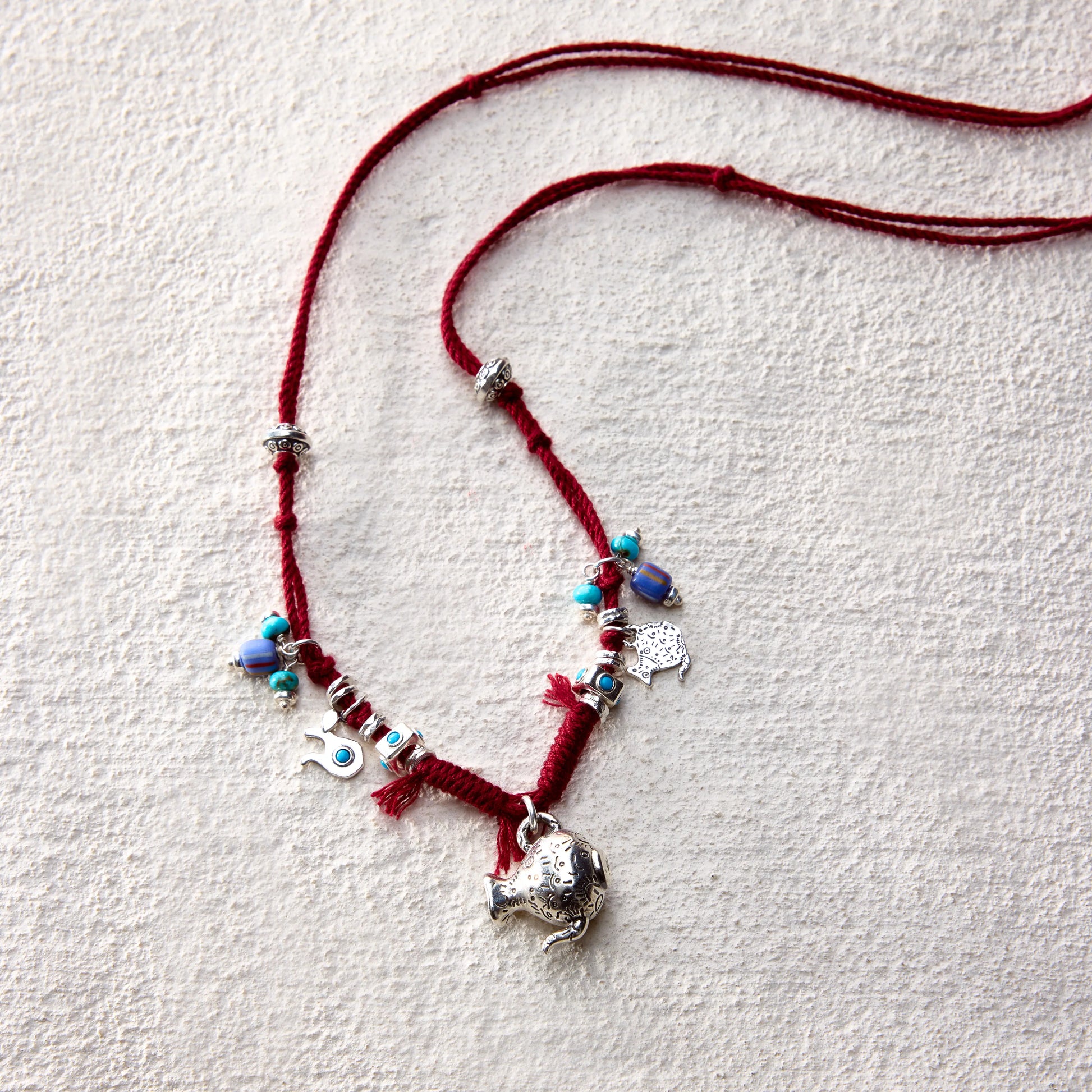 ensage-tokyo-nomads-vessel-necklace-red-braided-cotton-cord-silver-flask-pendant-turquoise-beads-charms