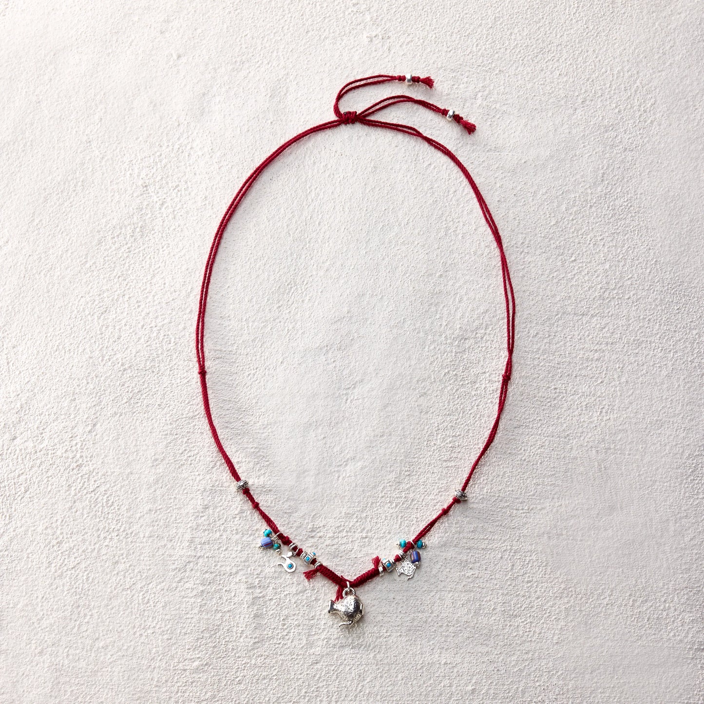ensage-tokyo-nomads-vessel-necklace-red-braided-cotton-cord-silver-flask-pendant-turquoise-beads-charms