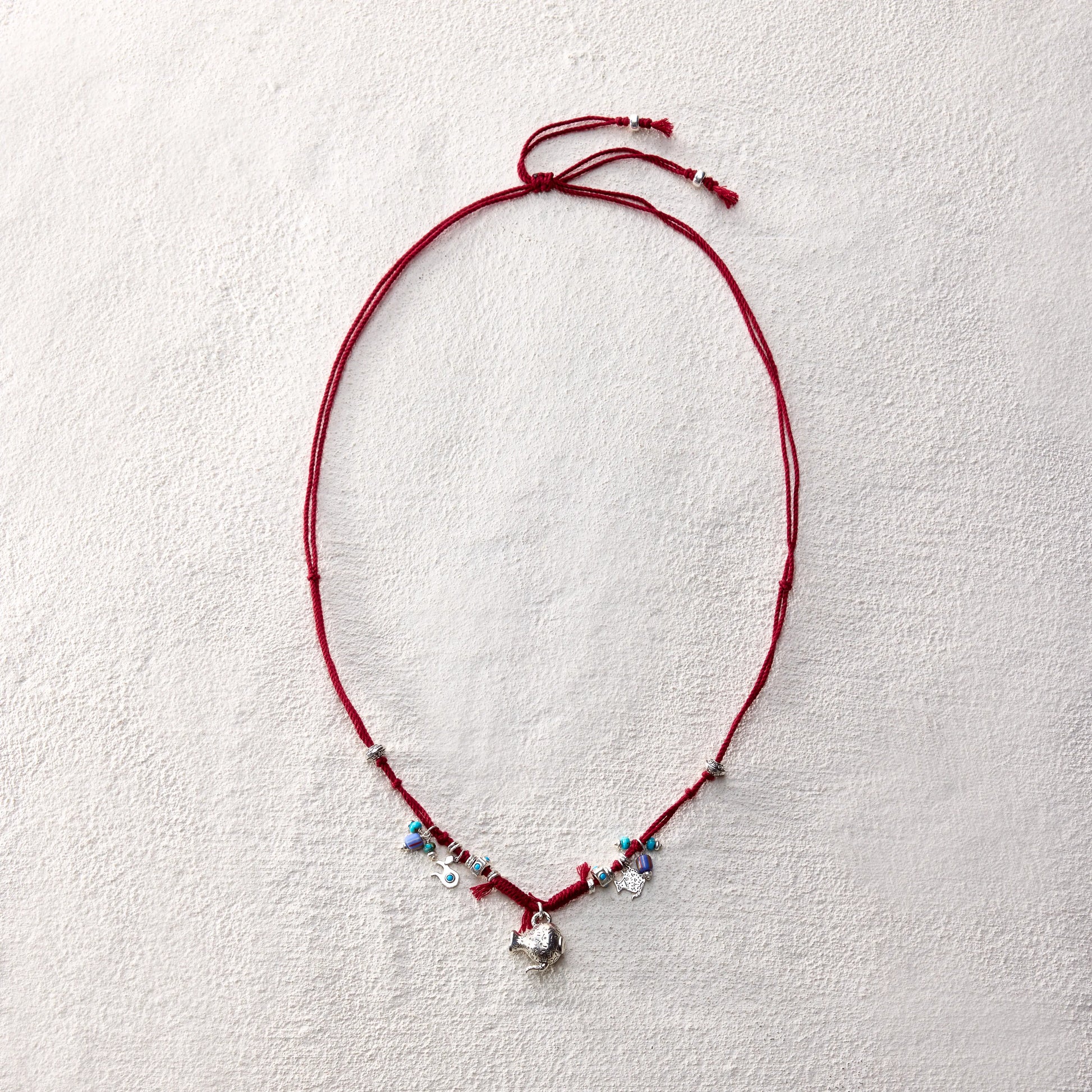 ensage-tokyo-nomads-vessel-necklace-red-braided-cotton-cord-silver-flask-pendant-turquoise-beads-charms
