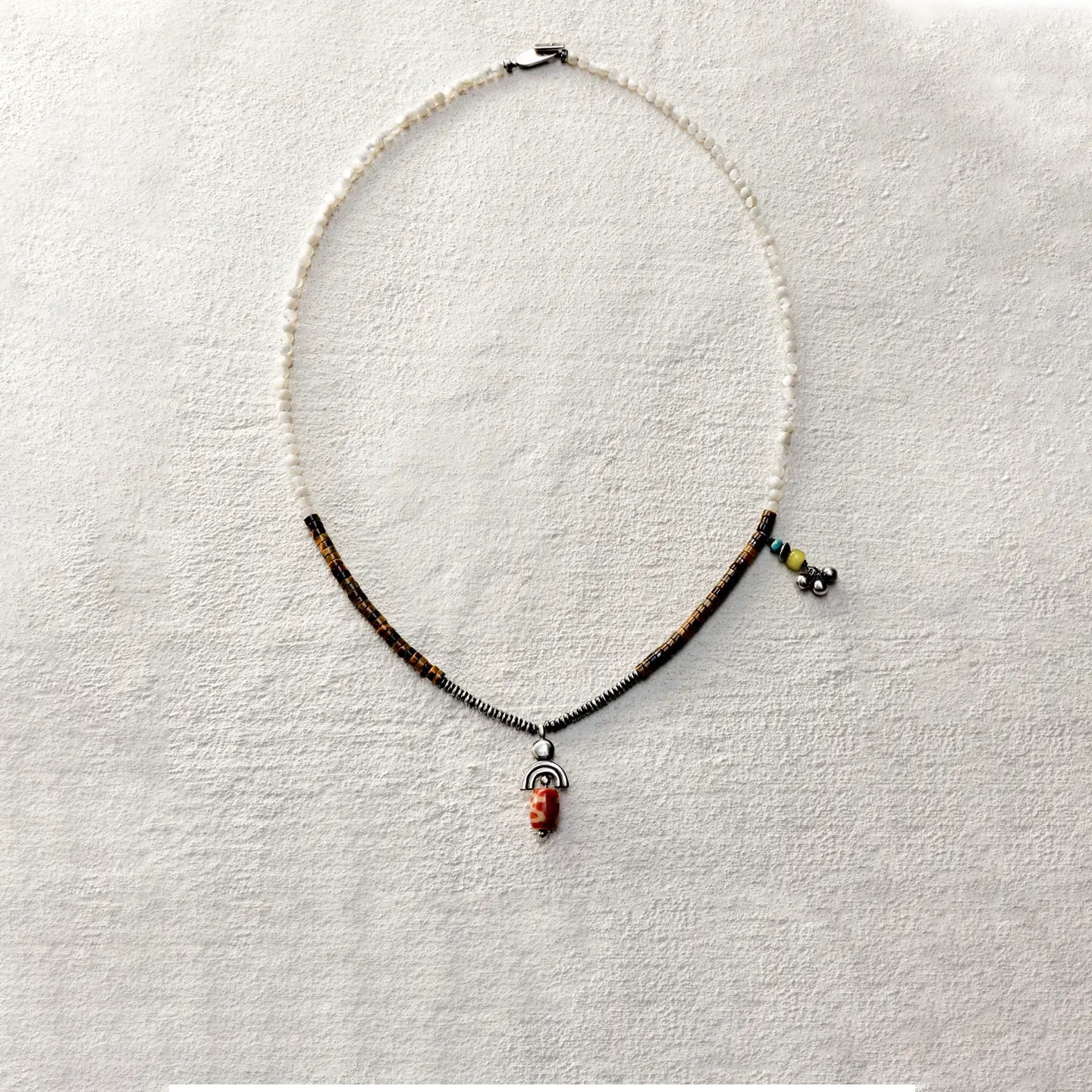 ensage-tokyo-trace-of-the-sun-necklace-white-shell-tiger-eye-oxidized-silver-agate-pendant-turquoise-charm