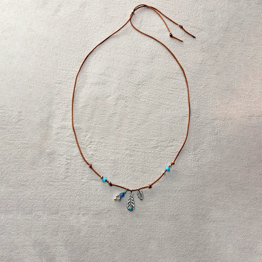 ensage-tokyo-whisper-of-the-wind-necklace-brown-waxed-cord-925-silver-feather-pendant-turquoise-blue-beads
